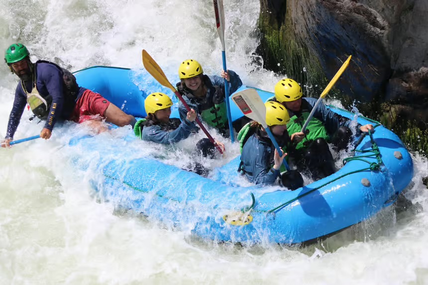 Rafting team navigating the Chili River rapids